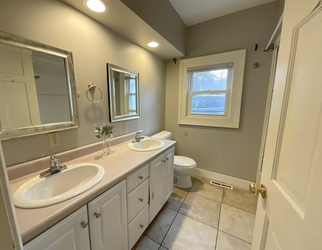 323 N Marshall Ave, Marshall, MI 49068 - bathroom with double vanity, tile patterned flooring, toilet, and a sink
