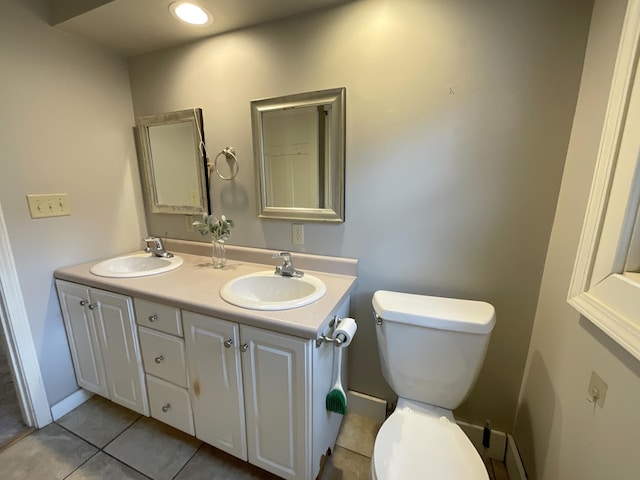 323 N Marshall Ave, Marshall, MI 49068 - bathroom with toilet, tile patterned floors, a sink, and double vanity