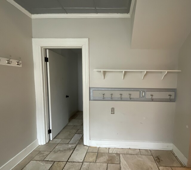 323 N Marshall Ave, Marshall, MI 49068 - laundry room with baseboards, crown molding, and stone finish floor