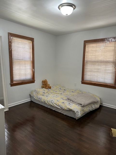 23226 Edward St, Dearborn, MI 48128 - bedroom featuring baseboards and dark wood-type flooring