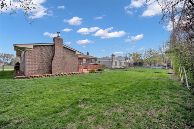 2946 Athena Dr, Troy, MI 48083 - view of yard with a deck and a fenced backyard