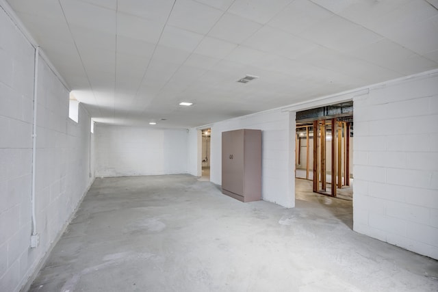 below grade area with concrete block wall and visible vents