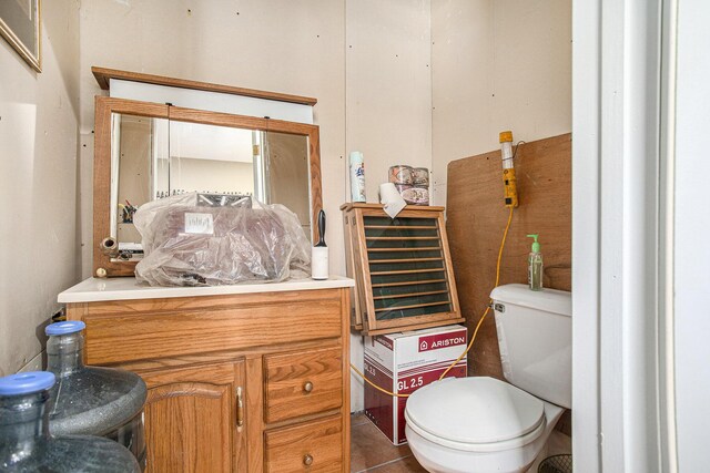 bathroom featuring toilet and vanity