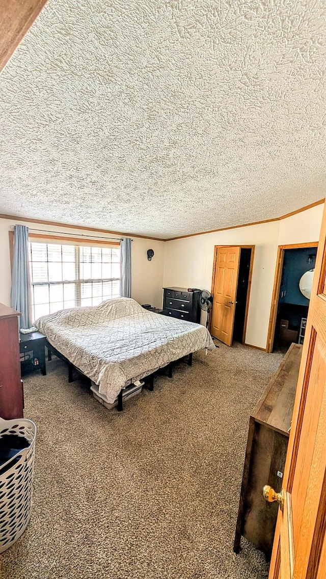 carpeted bedroom with a textured ceiling