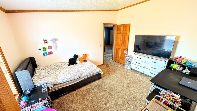 bedroom with a textured ceiling, light colored carpet, and crown molding