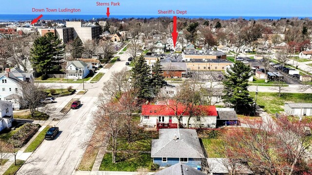 birds eye view of property with a residential view