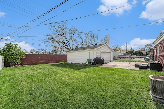 view of yard featuring an outdoor living space, a garage, cooling unit, a fenced backyard, and concrete driveway