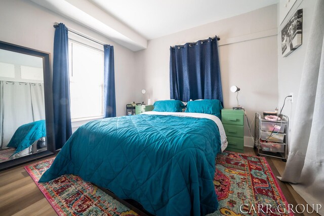 bedroom with wood finished floors