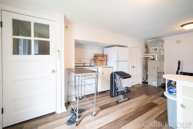 interior space featuring light wood-type flooring and visible vents