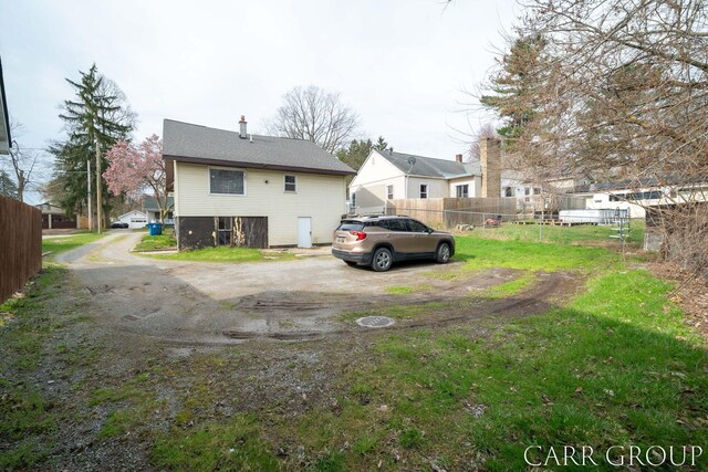 back of property with fence