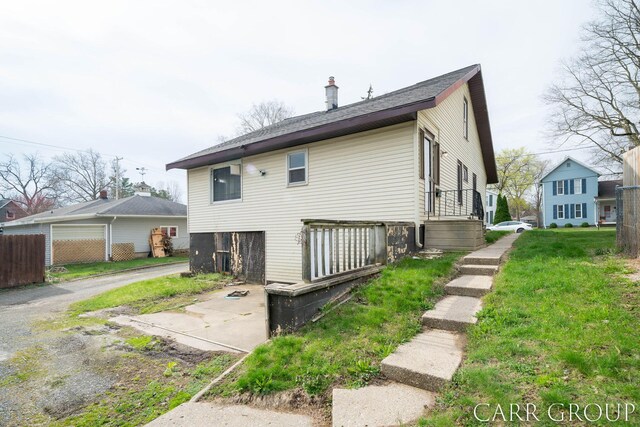 rear view of property featuring fence and a chimney