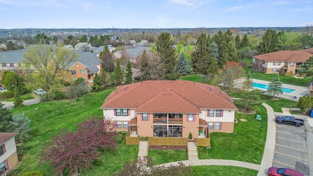 birds eye view of property with a residential view