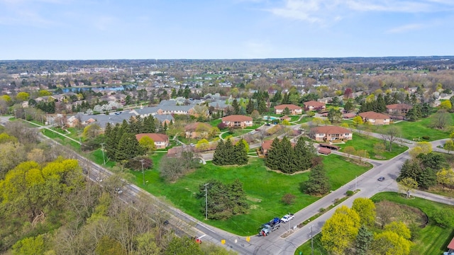 birds eye view of property with a residential view