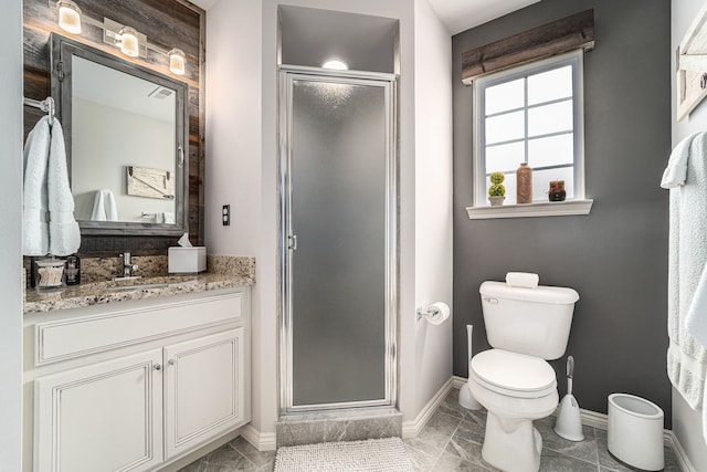 full bathroom with vanity, baseboards, a shower stall, and toilet