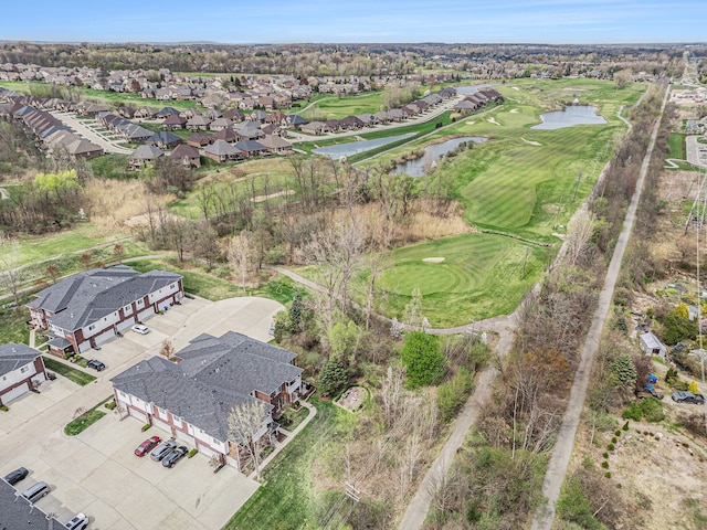 bird's eye view with a water view, view of golf course, and a residential view