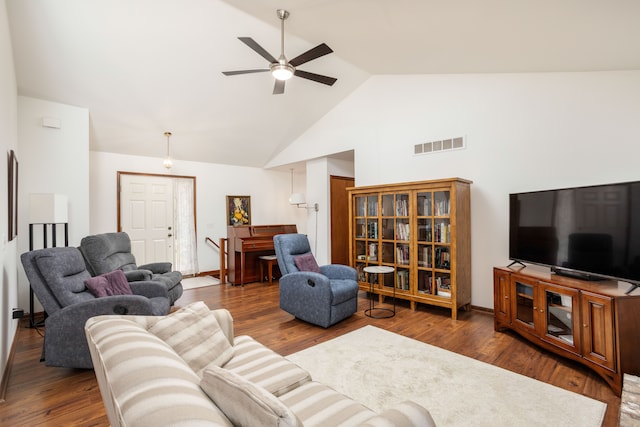 living room featuring visible vents, wood finished floors, ceiling fan, and high vaulted ceiling