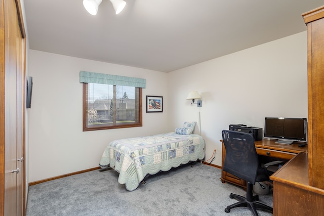 bedroom featuring carpet floors and baseboards