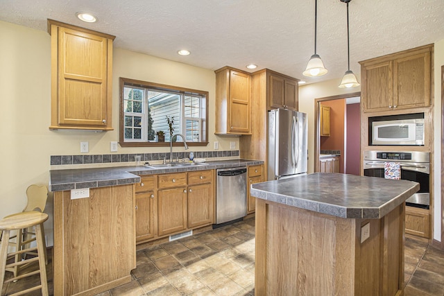17026 H Dr S, Marshall, MI 49068 - kitchen featuring stainless steel appliances, a sink, a textured ceiling, dark countertops, and visible vents