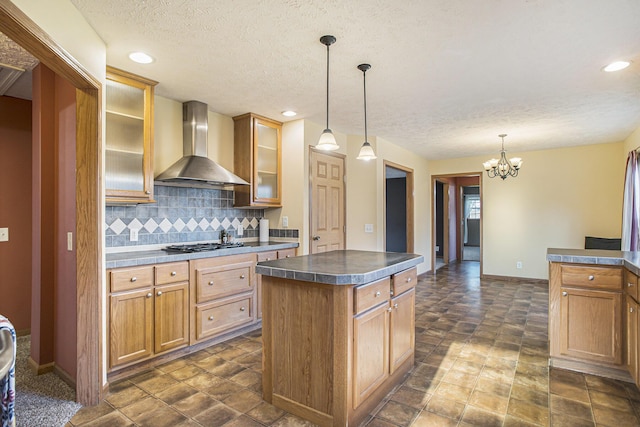 17026 H Dr S, Marshall, MI 49068 - kitchen with dark countertops, tasteful backsplash, a textured ceiling, a chandelier, and wall chimney exhaust hood