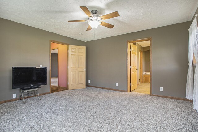 17026 H Dr S, Marshall, MI 49068 - unfurnished bedroom featuring carpet, baseboards, a textured ceiling, and ceiling fan