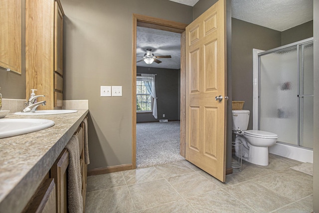 17026 H Dr S, Marshall, MI 49068 - bathroom featuring toilet, a ceiling fan, a textured ceiling, and a stall shower