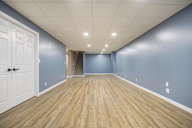 17026 H Dr S, Marshall, MI 49068 - finished basement with recessed lighting, stairway, wood finished floors, baseboards, and a paneled ceiling