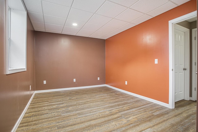 17026 H Dr S, Marshall, MI 49068 - spare room featuring wood finished floors, a drop ceiling, and baseboards