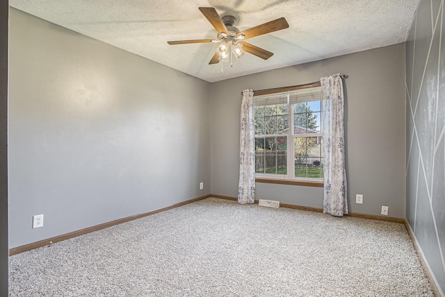 17026 H Dr S, Marshall, MI 49068 - carpeted spare room with baseboards, a textured ceiling, and ceiling fan
