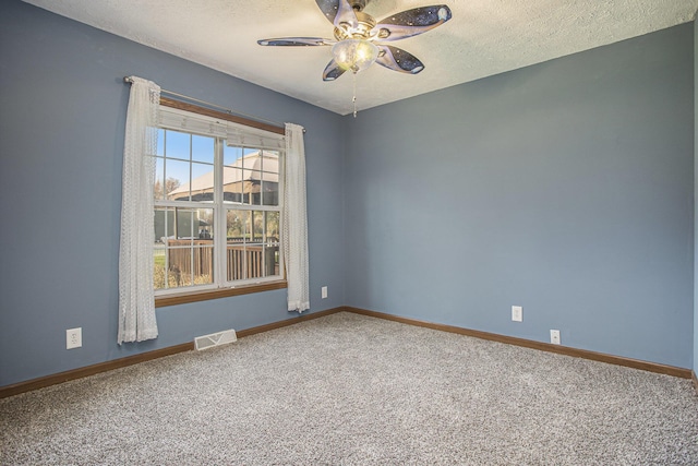 17026 H Dr S, Marshall, MI 49068 - spare room with carpet, visible vents, a ceiling fan, baseboards, and a textured ceiling