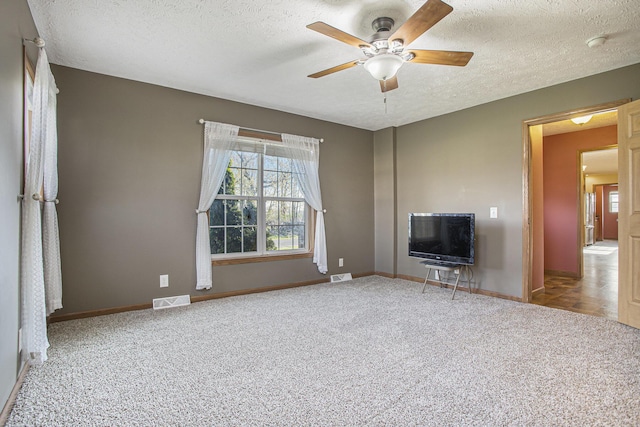 17026 H Dr S, Marshall, MI 49068 - unfurnished living room featuring a textured ceiling, visible vents, and carpet