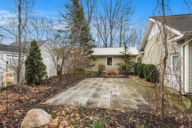 view of patio featuring fence