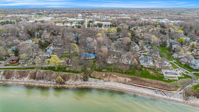 drone / aerial view featuring a water view and a residential view