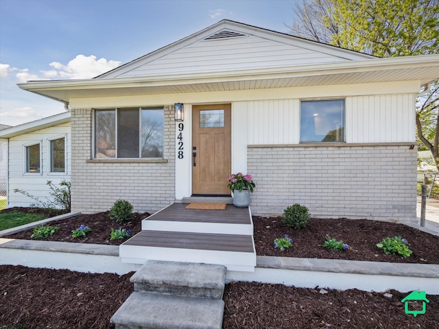 view of front of house featuring brick siding