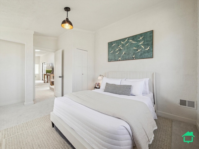 bedroom with visible vents, crown molding, carpet flooring, and baseboards