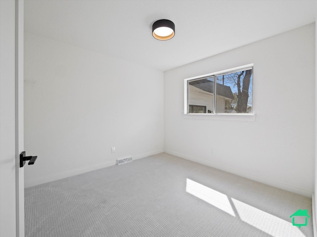 carpeted spare room with visible vents