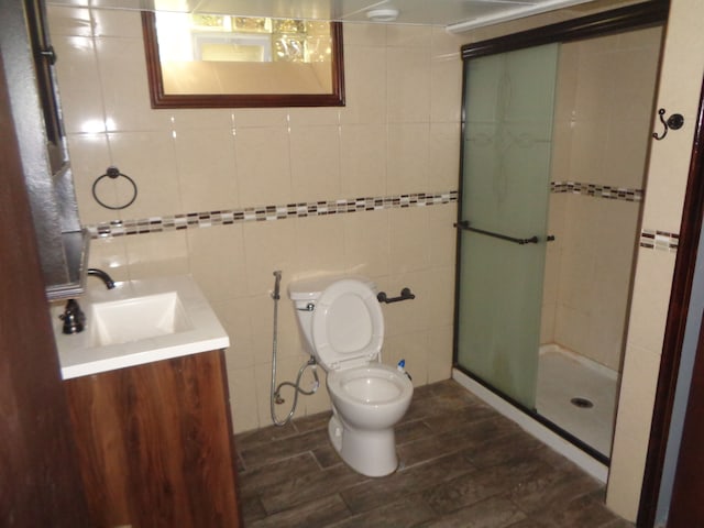1353 N Gulley Rd, Dearborn Heights, MI 48127 - full bath featuring a shower stall, wood finished floors, vanity, tile walls, and toilet