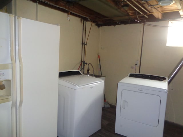 1353 N Gulley Rd, Dearborn Heights, MI 48127 - washroom with separate washer and dryer, dark wood-style floors, and laundry area