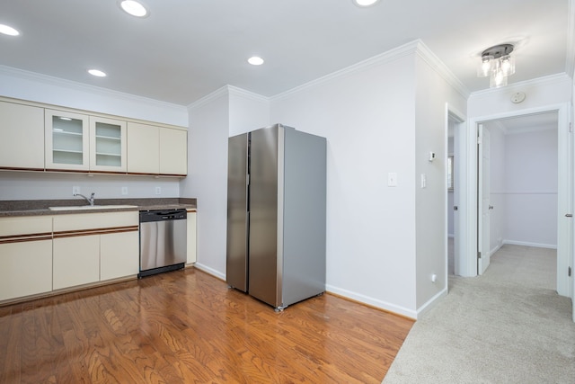 kitchen with white cabinets, stainless steel appliances, glass insert cabinets, and wood finished floors