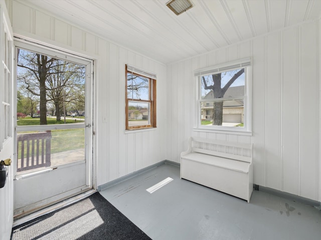unfurnished sunroom with visible vents