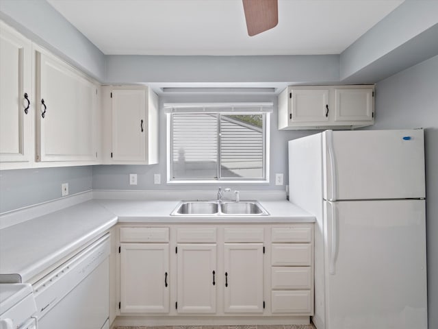 kitchen featuring a sink, white cabinets, white appliances, and light countertops