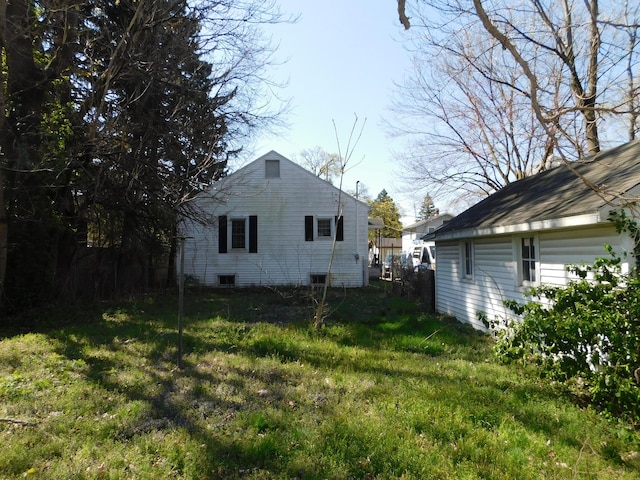 view of property exterior featuring a lawn