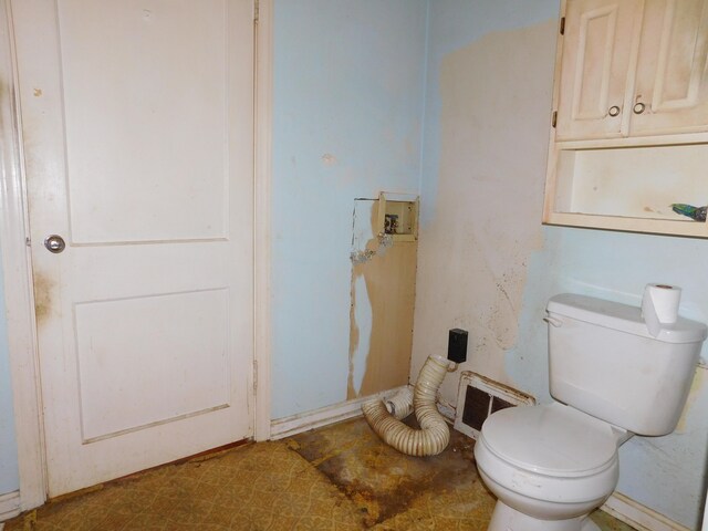 bathroom with visible vents and toilet
