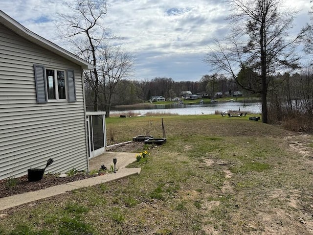 4605 Hunters Trl, Six Lakes, MI 48886 - view of yard featuring a water view