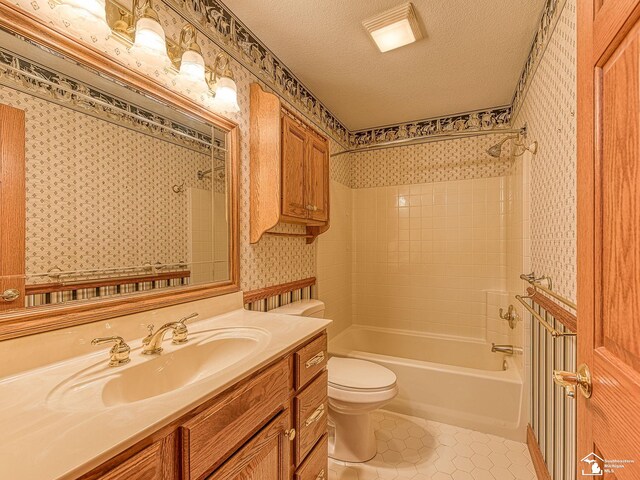 3158 Lennox Ct, Lambertville, MI 48144 - bathroom with wallpapered walls, toilet, a textured ceiling,  shower combination, and tile patterned flooring