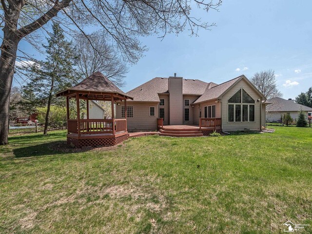 3158 Lennox Ct, Lambertville, MI 48144 - back of house with a gazebo, a lawn, a deck, a chimney, and a shingled roof