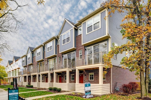 1737 Merrick St # 12, Detroit, MI 48208 - view of front of property featuring brick siding, board and batten siding, and a residential view
