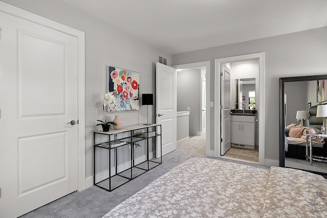 1737 Merrick St # 12, Detroit, MI 48208 - bedroom with light colored carpet, baseboards, and a sink