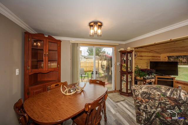 dining room featuring crown molding and wood finished floors