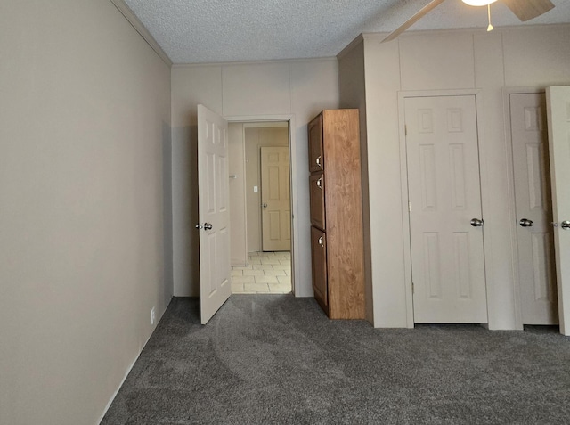 2401 Schippers Ln, Kalamazoo, MI 49048 - unfurnished bedroom with a textured ceiling and carpet