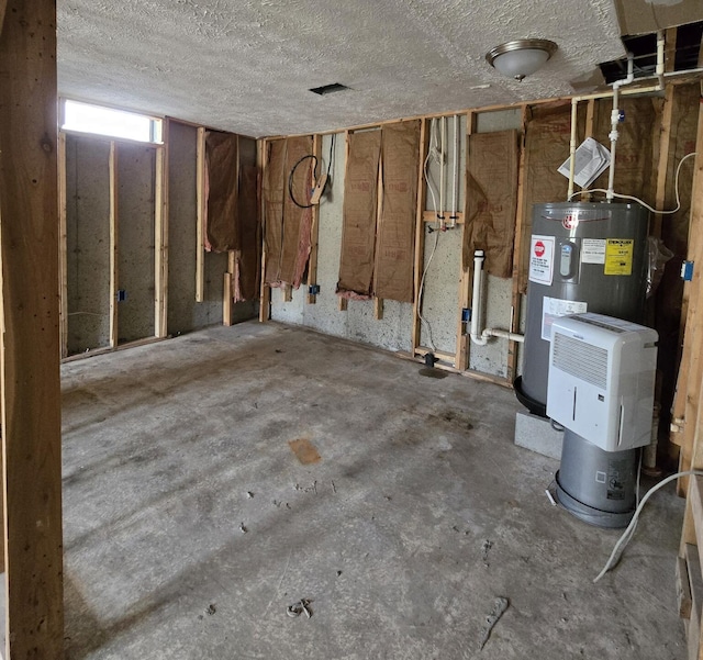 2401 Schippers Ln, Kalamazoo, MI 49048 - basement with water heater and a textured ceiling